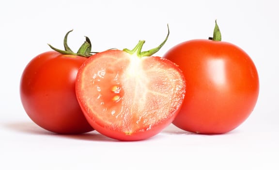 fresh tomatoes on the white background 