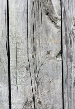 Close up of gray wooden fence panels 