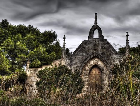 Saint Simeon Chapel next to a beautiful derelict castle lying on the Wardija hilltop in Malta