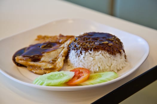 grilled chicken, rice with teriyaki sauce and tomato