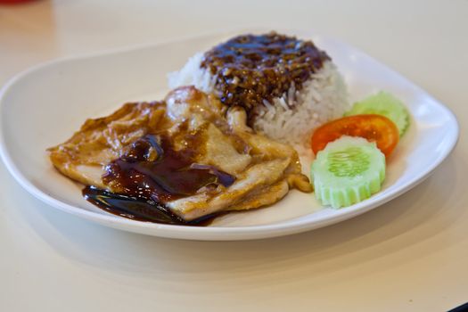 grilled chicken, rice with teriyaki sauce and tomato