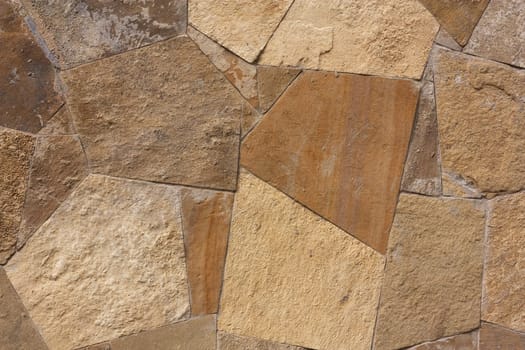 Unshaped stone wall pattern,wall made of rocks 