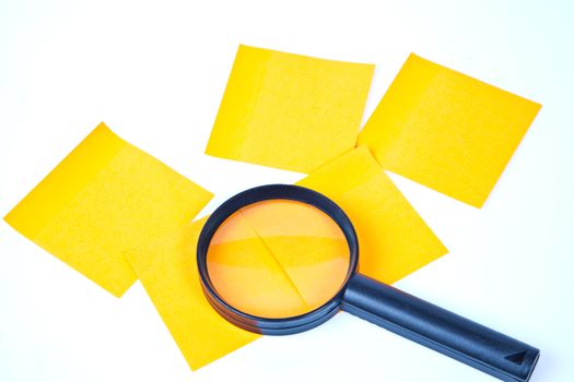 a magnifying glass hovering over the post-it Inspection