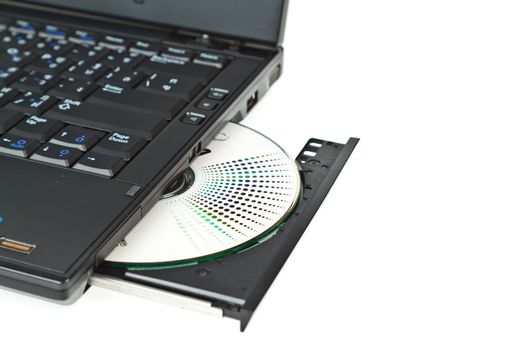 close up of a dvd in a laptop tray