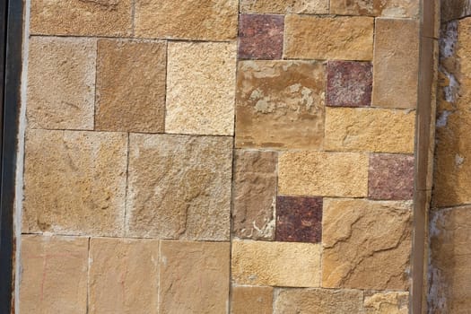 Unshaped stone wall pattern,wall made of rocks 