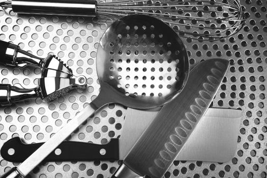 Overhead shot of kitchen utensils on stainless steel
