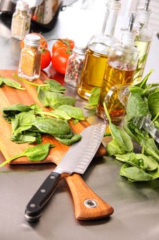 Preparing spinach  leaves on cutting board