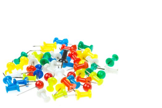 isolated colorful pushpins focus at black