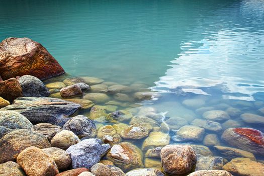 Closeup of rocks in water at lake Louise, Alberta