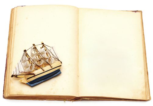 old book and ship on white background