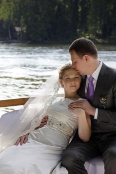Newly-married couple on the river