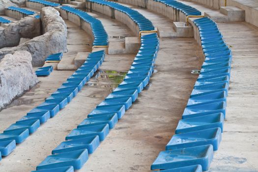 old plastic blue seats on stadium