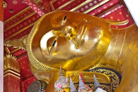 gold buddha with smiling face