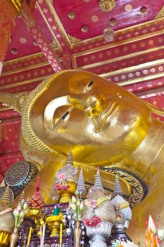 gold buddha with smiling face