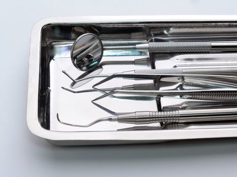 Dental Instruments on white background, metal, iron, steel, mirror