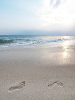 Footprints on the sandy shore in an island in Malaysia