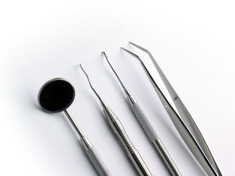 Close-up Dental Instruments on white background, angle