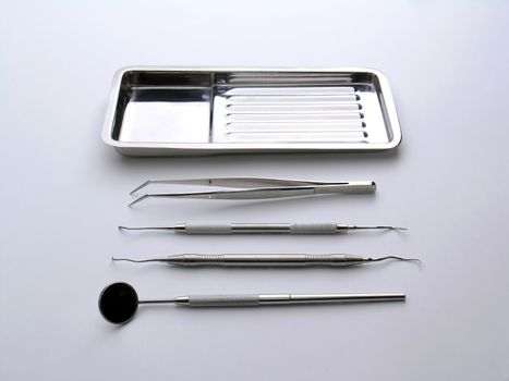 Close-up Dental Instruments on white background, metal, iron, steel, mirror