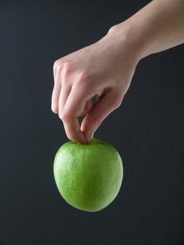 Apple hanging in gand