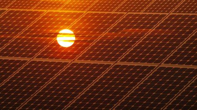 Renewable energy concept with photovoltaic panel and red sun