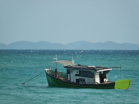 Colorful boat anchored in the South China sea in Malaysia