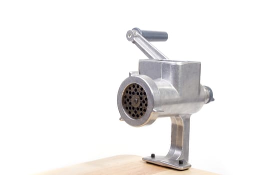 The disassembled meat grinder on a white background.
