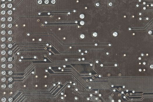 The printed-circuit board with electronic components macro background