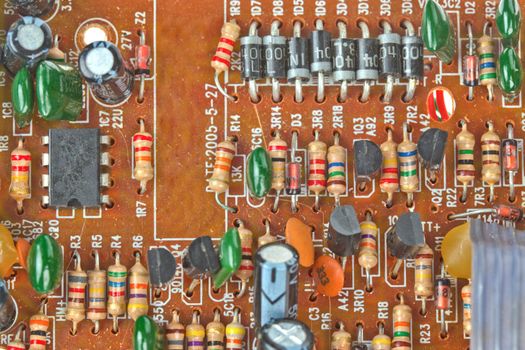 The printed-circuit board with electronic components macro background