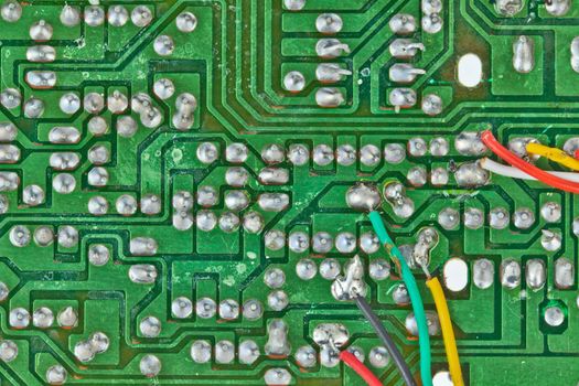 The printed-circuit board with electronic components macro background