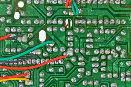 The printed-circuit board with electronic components macro background