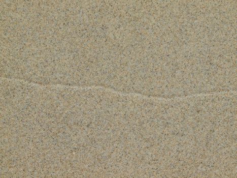 Sand background with a crossing path line