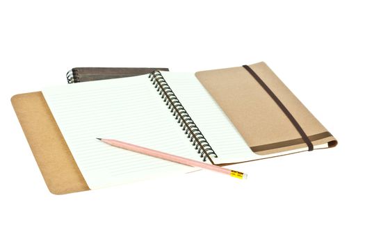 Pencil on Light cream color paper note book on brown book