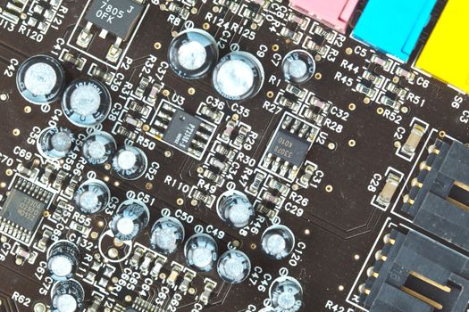 The printed-circuit board with electronic components macro background