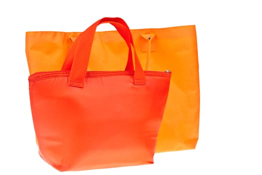 Colorful red and orange cotton bag on white isolated background.