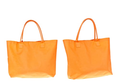 Colorful orange cotton bag on white isolated background.