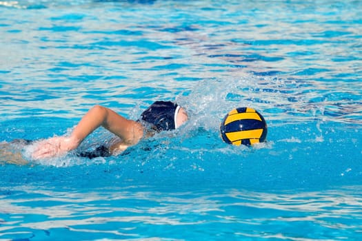 Water polo action and equipment in a swimming pool