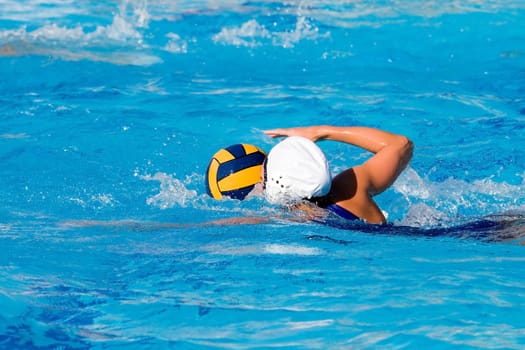 Water polo action and equipment in a swimming pool