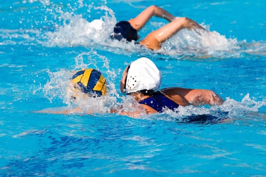 Water polo action and equipment in a swimming pool