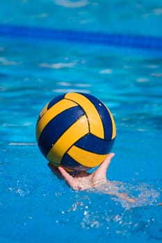 Water polo action and equipment in a swimming pool