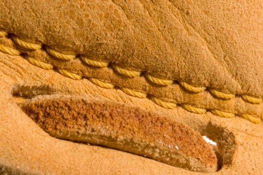 A baseball glove or mitt close up series of its leather deatils