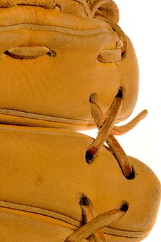 A baseball glove or mitt close up series of its leather deatils