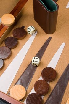 Backgammon game board with dice, pieces, and bars