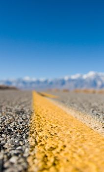 Close up of a desert highway lane marker