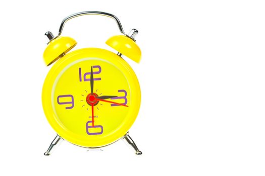 Clock, Yellow clock, showing nine o'clock, Isolated