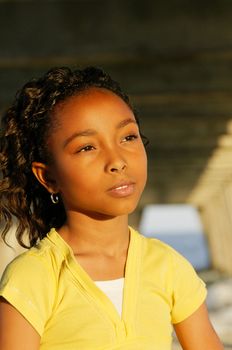 An African-American girl at the beach.