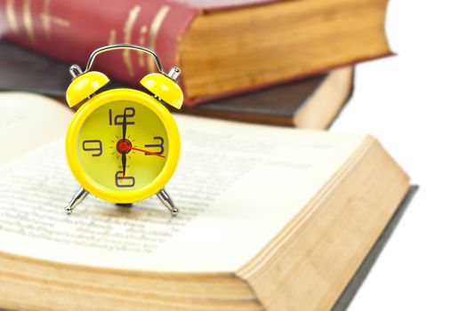 Clock and book as time management concept