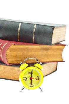 Clock and book as time management concept