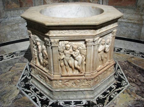 An ancient baptistry in a church in Italy.