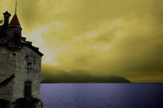 Image of partial castle on left with yelllow sky, clouds, mountains and Lake Geneva.