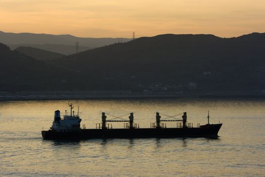 Image of a transportation ship leaving the harbour